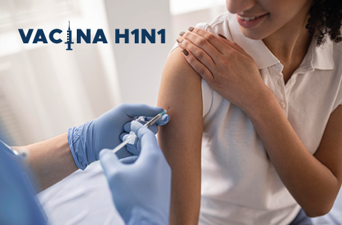 Imagem de uma mulher tomando vacina no braço. Ao lado, a inscrição em azul 'Vacina H1N1'